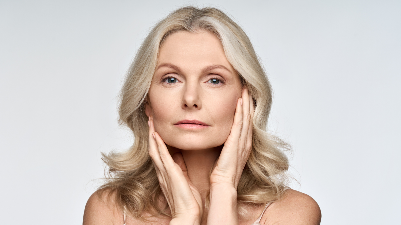 Mature woman with healthy, radiant skin representing the benefits of peptides in skin care for improving firmness, elasticity, reducing fine lines, and supporting a youthful complexion.